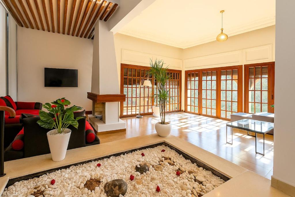 a living room with a large rug on the floor at Spacious villa in Founty, beach side 40m front Sofitel in Agadir