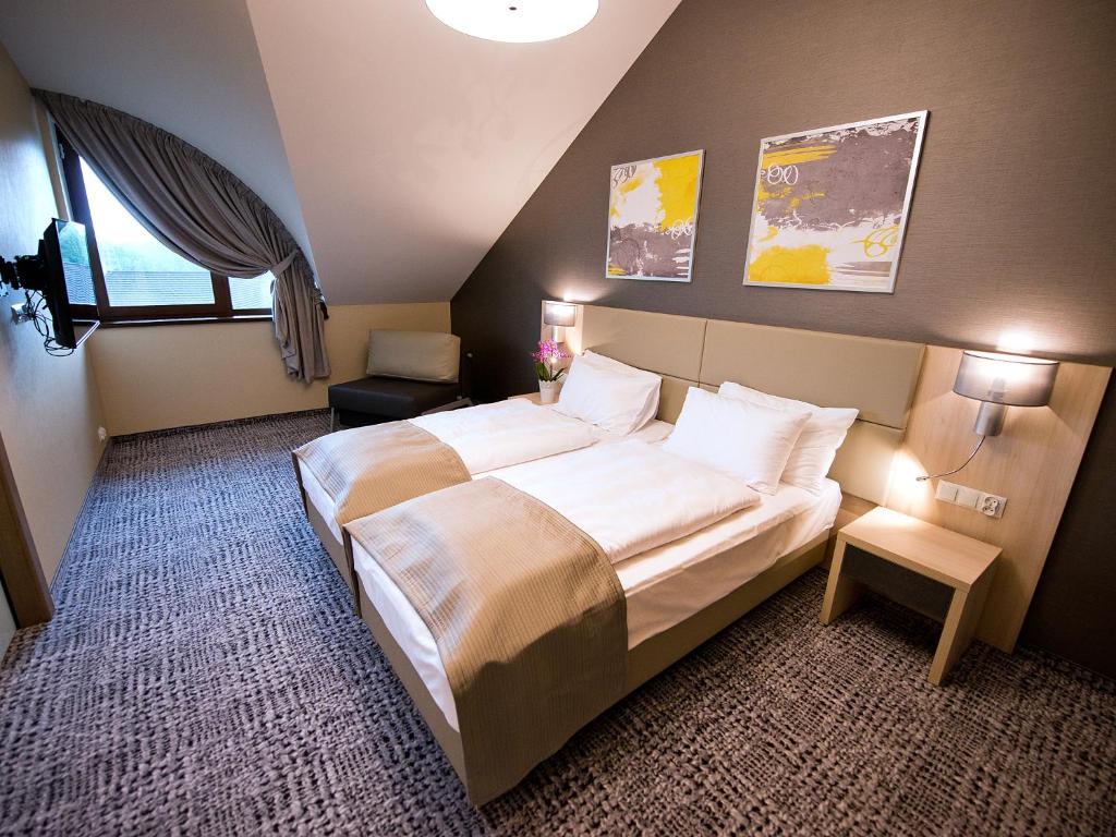 Postel nebo postele na pokoji v ubytování Hotel Molo Resort