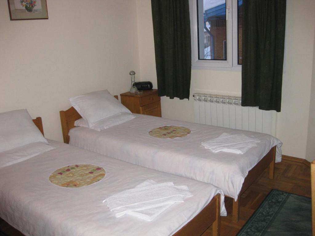 Postel nebo postele na pokoji v ubytování Niko Hotel