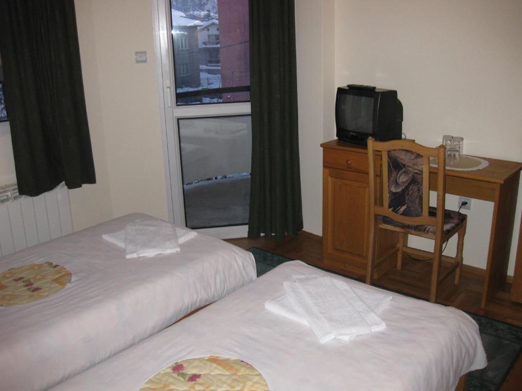 Postel nebo postele na pokoji v ubytování Niko Hotel