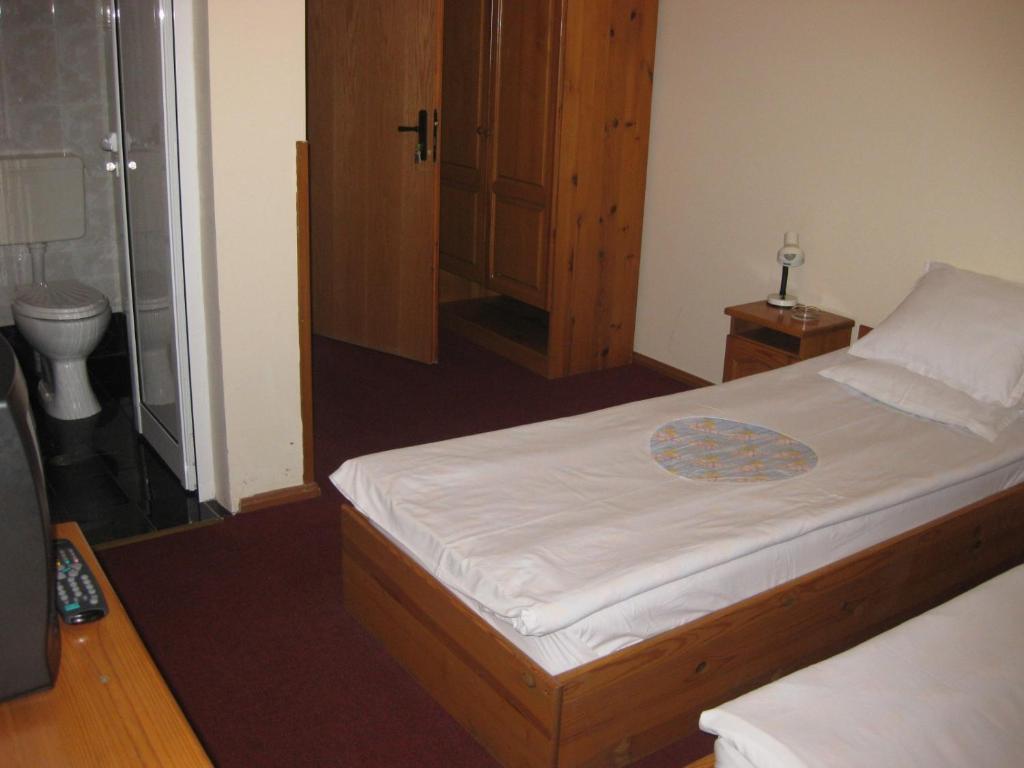 Postel nebo postele na pokoji v ubytování Niko Hotel