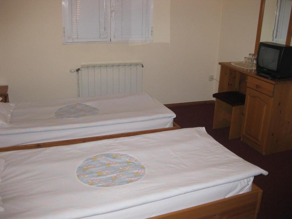 Postel nebo postele na pokoji v ubytování Niko Hotel