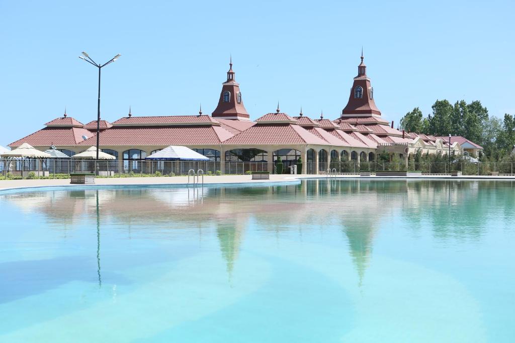 a large pool of water in front of a building at EL Faro RESORT AND SPA HOTEL in Nabran