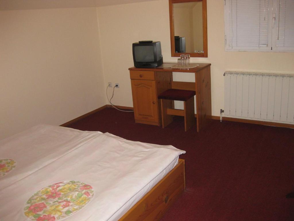 Postel nebo postele na pokoji v ubytování Niko Hotel