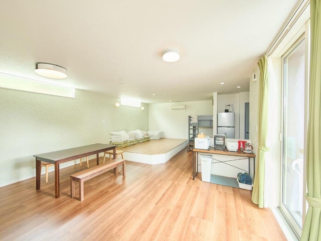 a living room with a couch and a table at Chocotto Villa Maestro - Vacation STAY 74540v in Sumoto