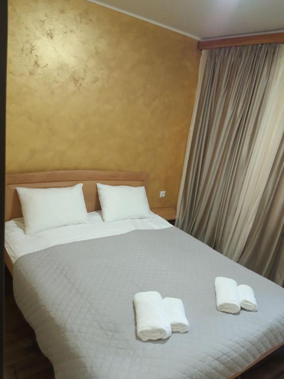Postel nebo postele na pokoji v ubytování Lastili Inn Hotel