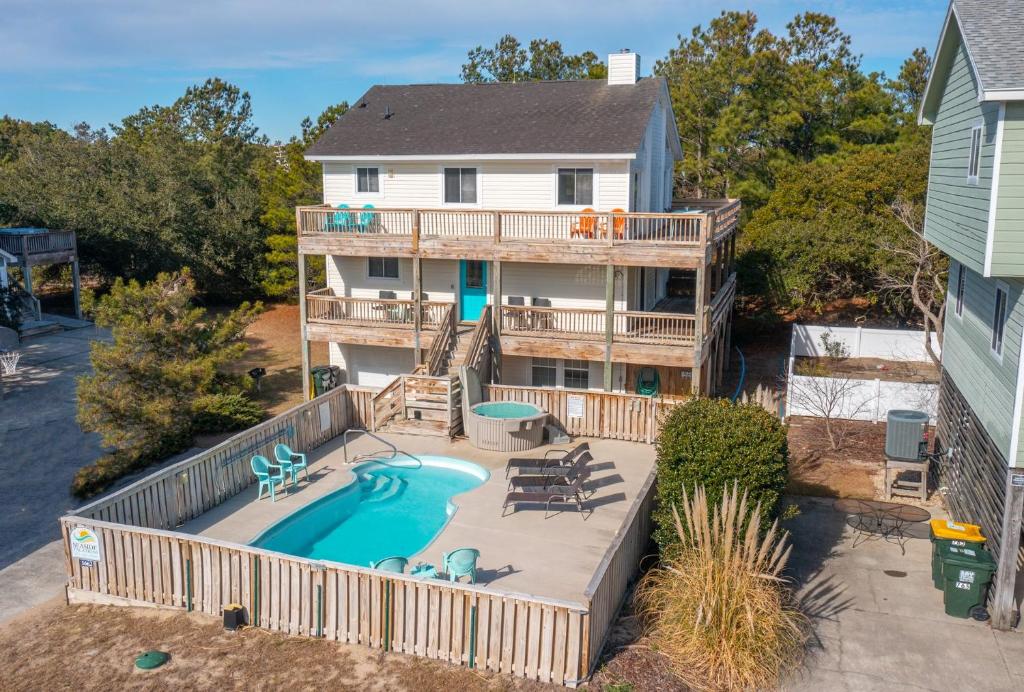 an aerial view of a house with a swimming pool at 1662 - Dune Our Thing in Corolla
