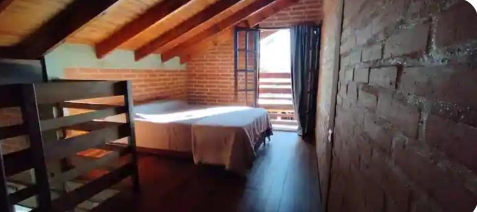 Posteľ alebo postele v izbe v ubytovaní Acogedora cabaña en el corazón de Nono