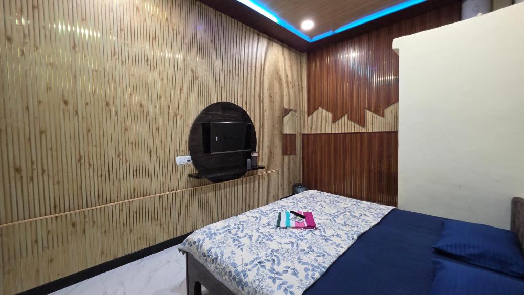 Ένα ή περισσότερα κρεβάτια σε δωμάτιο στο Pallav Guest House