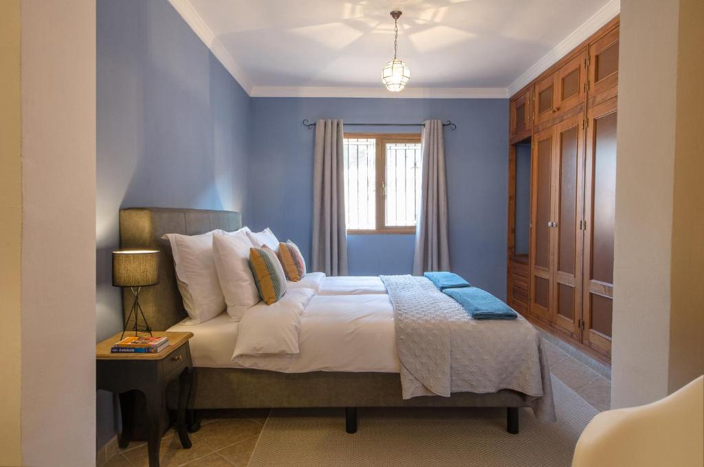 Postel nebo postele na pokoji v ubytování Villa Conmigo Bed & Breakfast