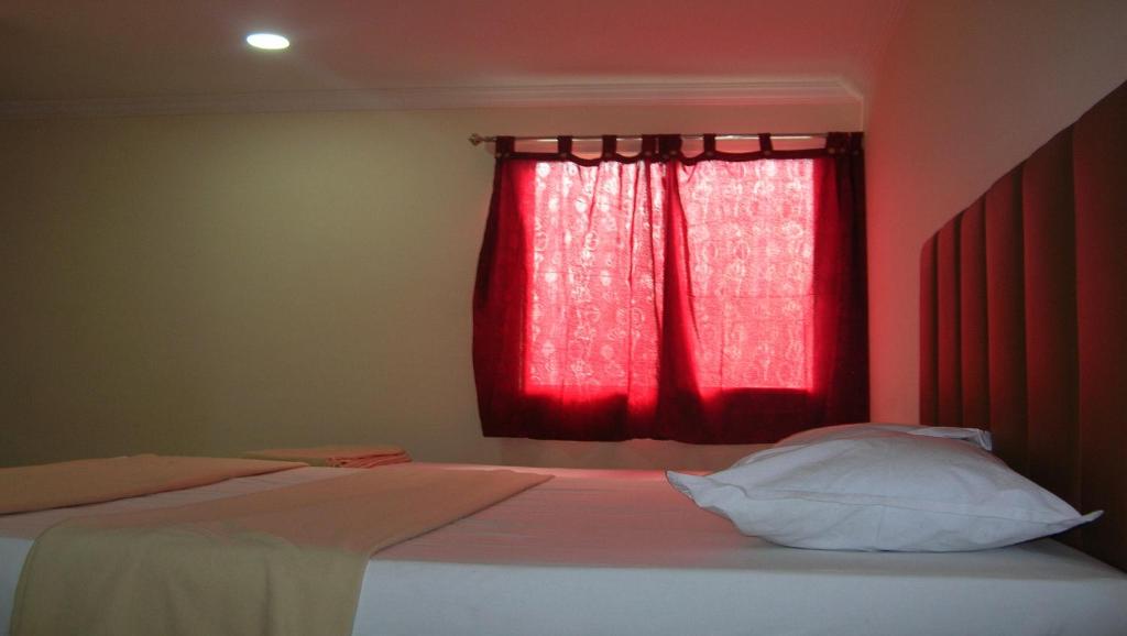 Postel nebo postele na pokoji v ubytování Hotel Woodside