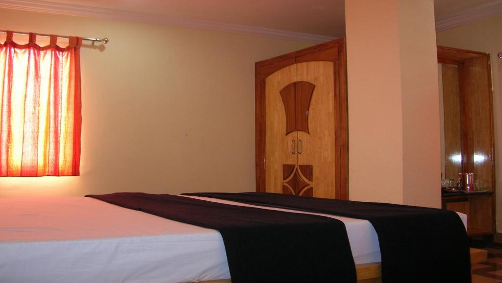 Postel nebo postele na pokoji v ubytování Hotel Woodside