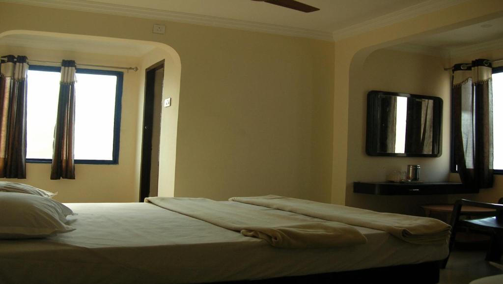 Postel nebo postele na pokoji v ubytování Hotel Woodside
