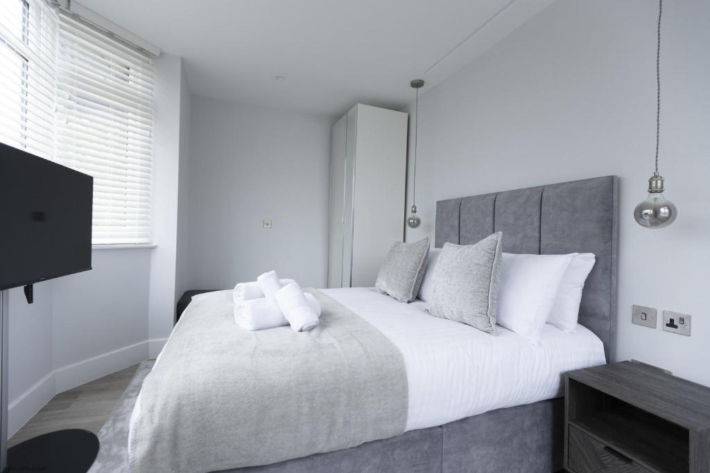 Giường trong phòng chung tại Bell House Oxford - The Punt