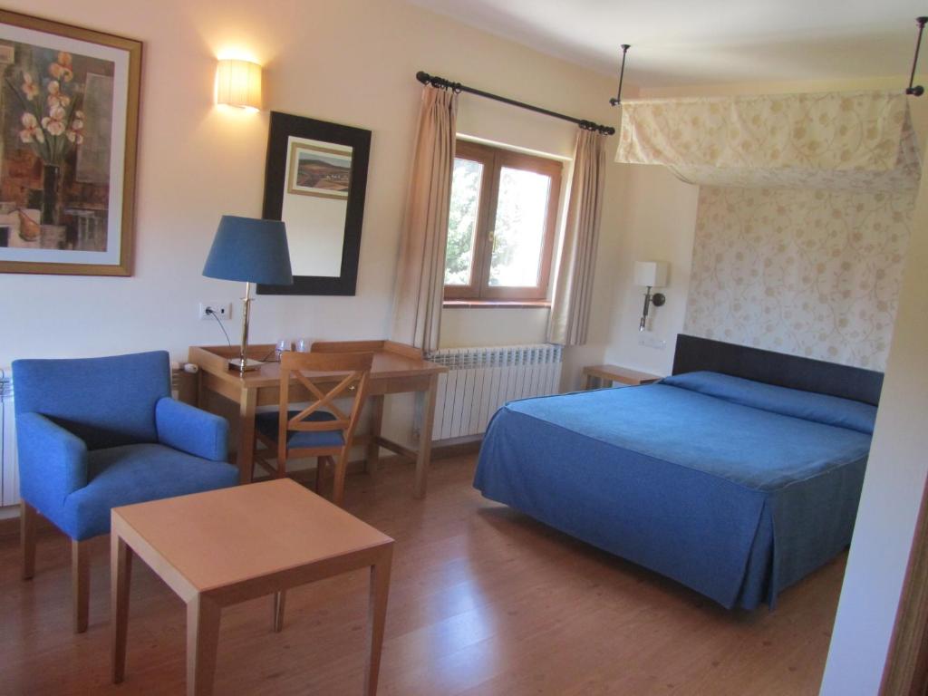 Postel nebo postele na pokoji v ubytování Hotel Galayos