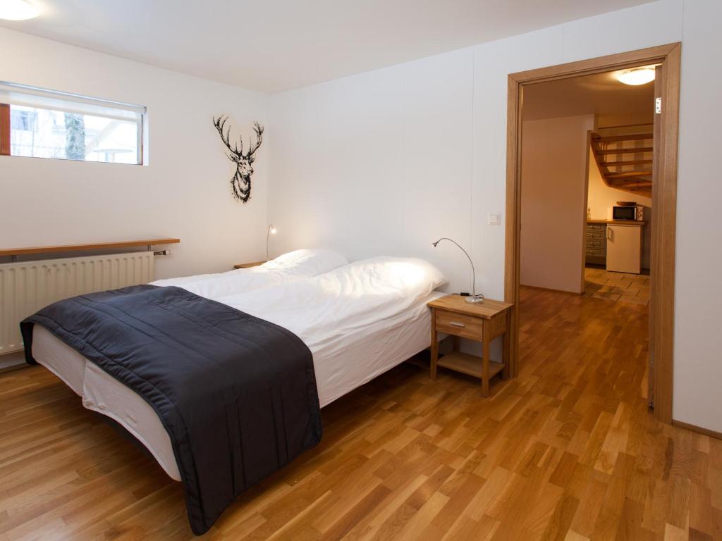 Postel nebo postele na pokoji v ubytování SKOLO Apartment