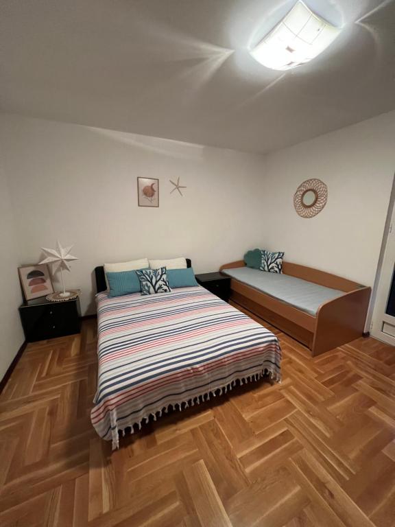 Postel nebo postele na pokoji v ubytování Komforan studio u centru grada