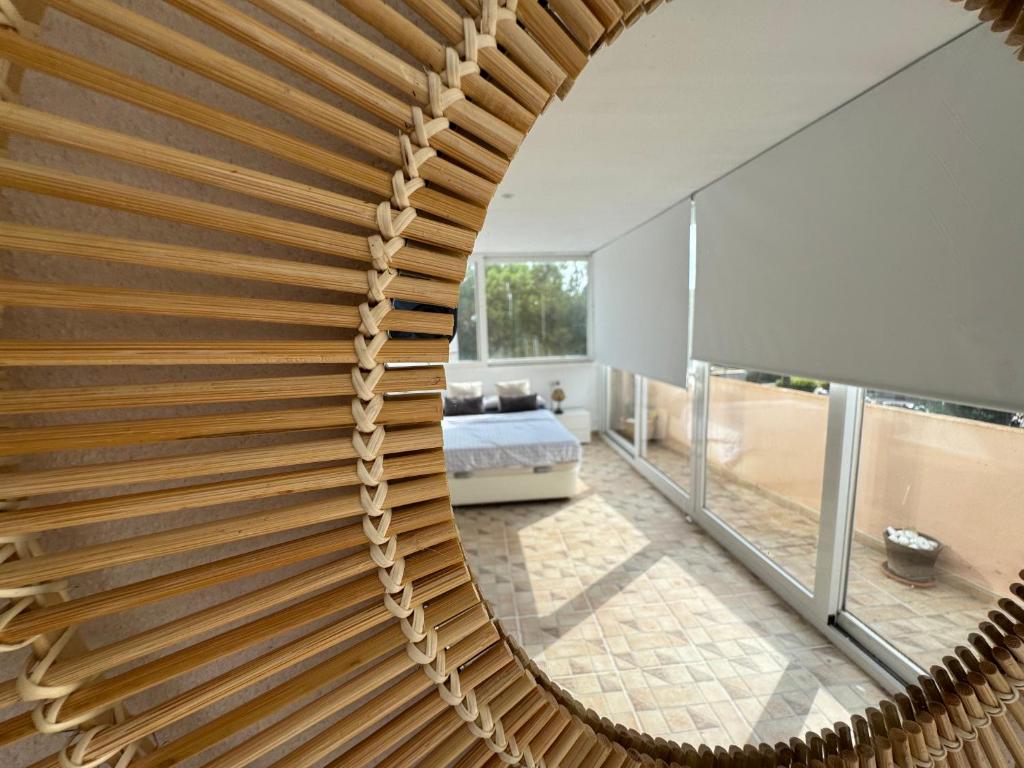 a wooden spiral staircase in a house at Villa Alicante Beach in El Campello
