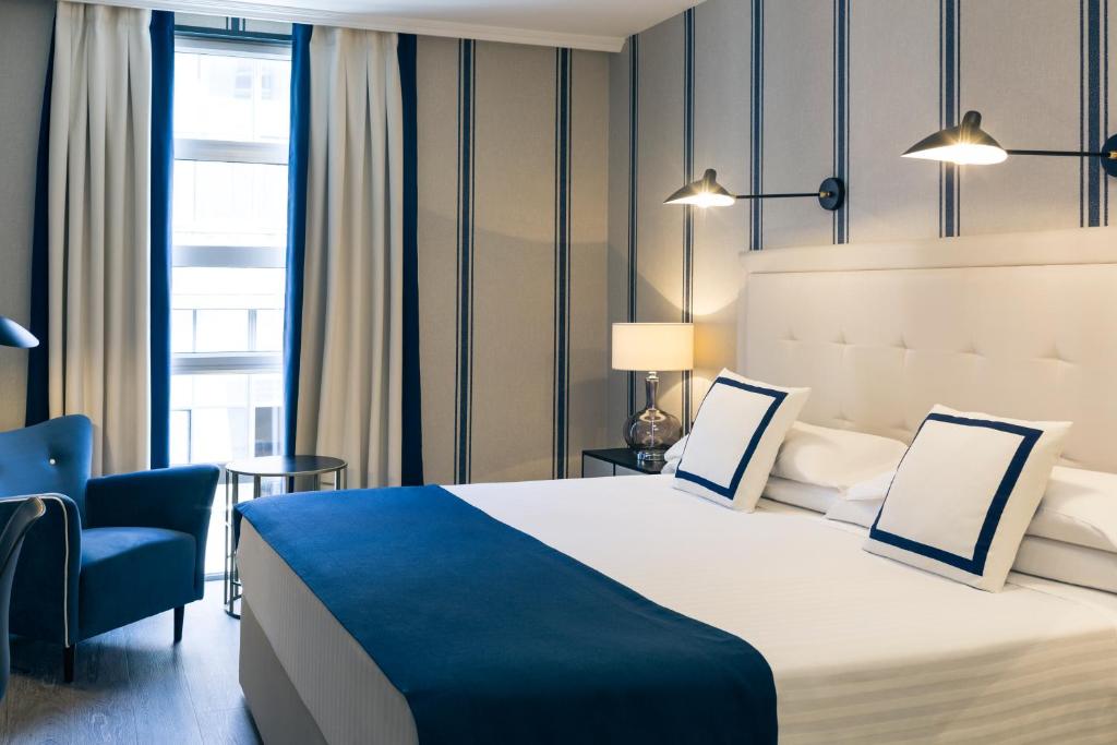 Postel nebo postele na pokoji v ubytování Hotel Mercure Jardines de Albia