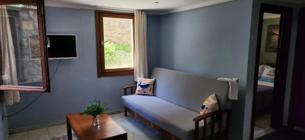 Ένα ή περισσότερα κρεβάτια σε δωμάτιο στο Stone House Hotel