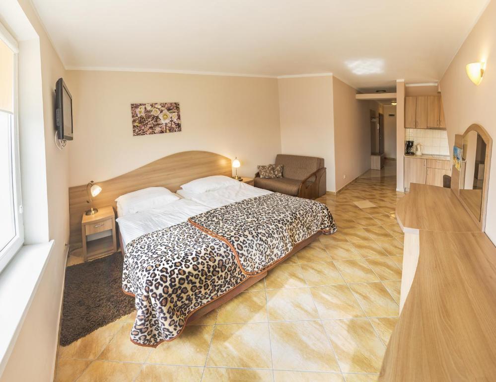 Posteľ alebo postele v izbe v ubytovaní Apartamenty Rok