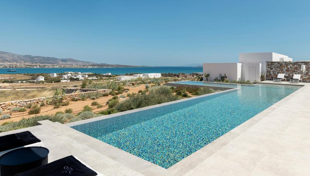 an image of a swimming pool in a building at TWWO Antiparos in Antiparos