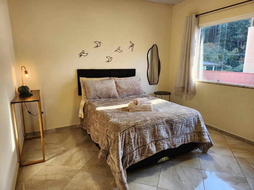 Ένα ή περισσότερα κρεβάτια σε δωμάτιο στο Apartamento Agradável