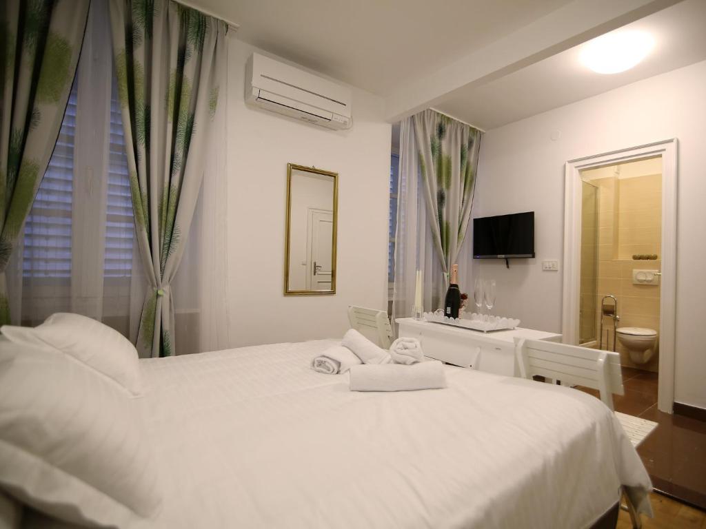 Posteľ alebo postele v izbe v ubytovaní A&G Apartments