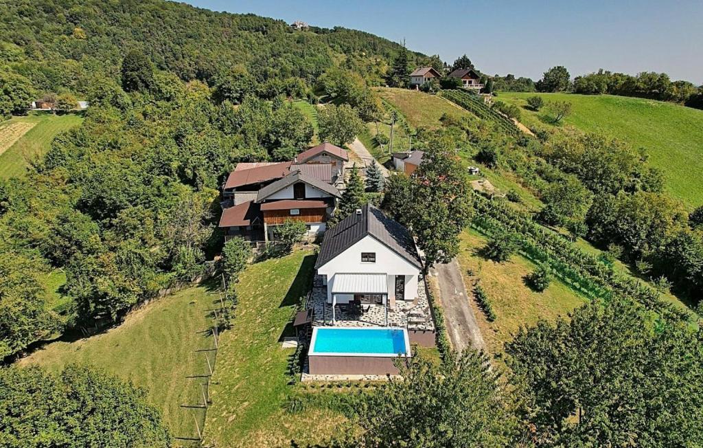 an aerial view of a house on a hill with a pool at Holiday Home Lipa by Villas Guide in Ivančići