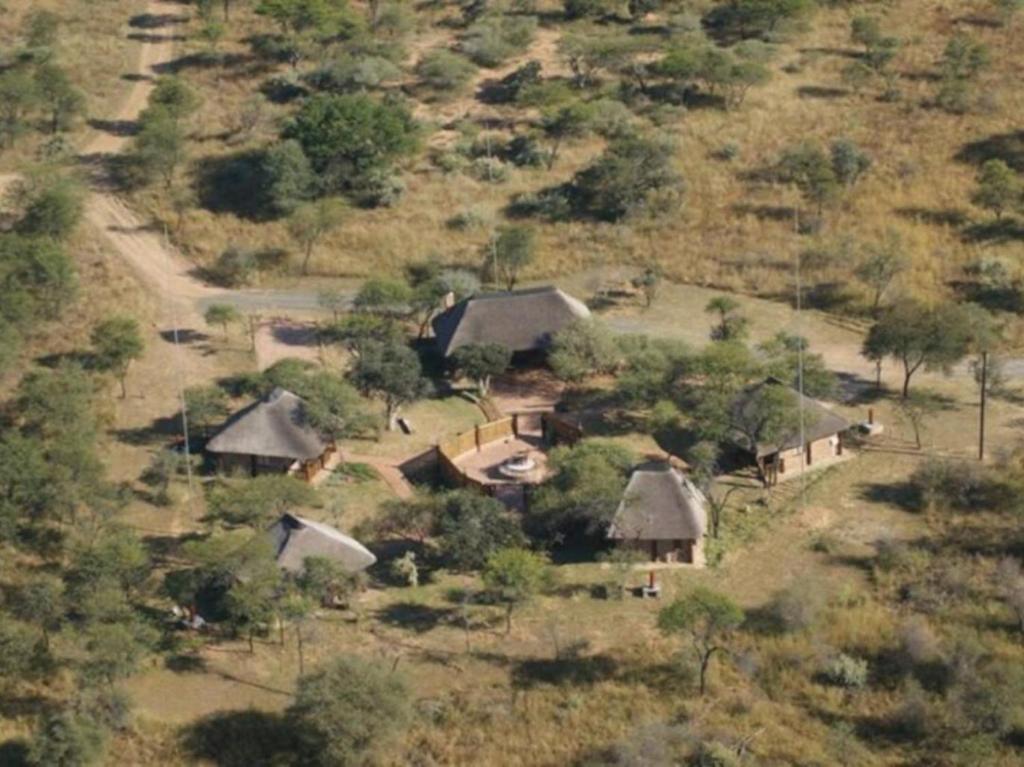 an aerial view of a group of huts in a field at Witgatboom Boskamp in Naboomspruit