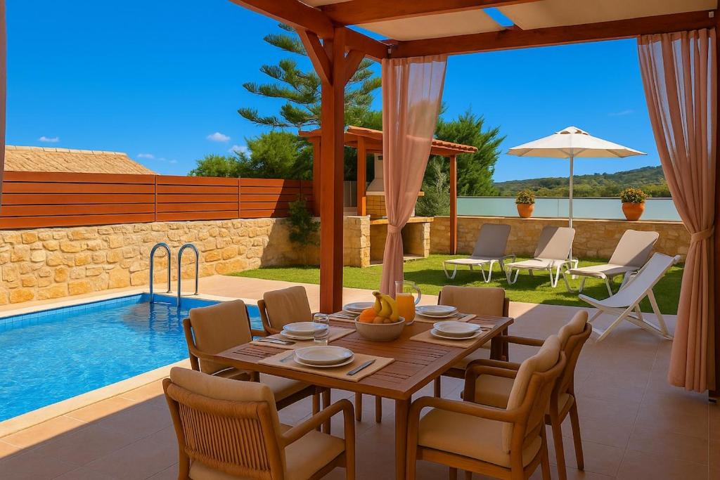 a dining table and chairs in a patio with a pool at Harma Villa Comfort & Relaxation in Roúpai