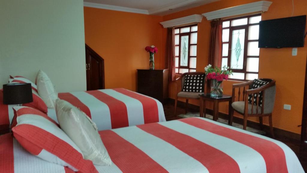 Postel nebo postele na pokoji v ubytování Hotel Margarita 2