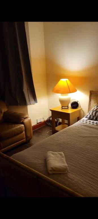 Postel nebo postele na pokoji v ubytování Cozy Guest House