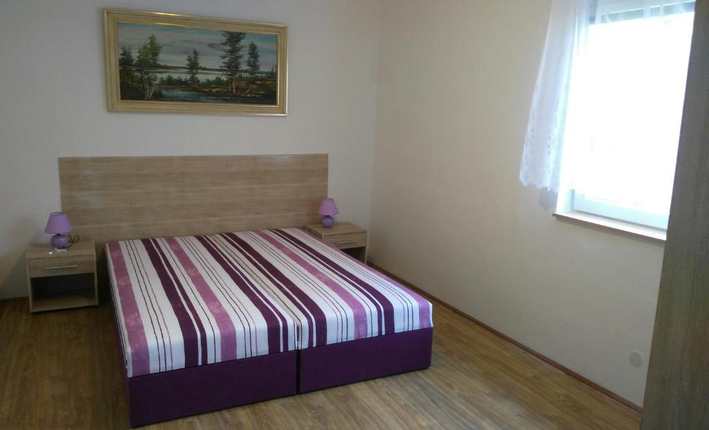 Łóżko lub łóżka w pokoju w obiekcie Penzion Renata