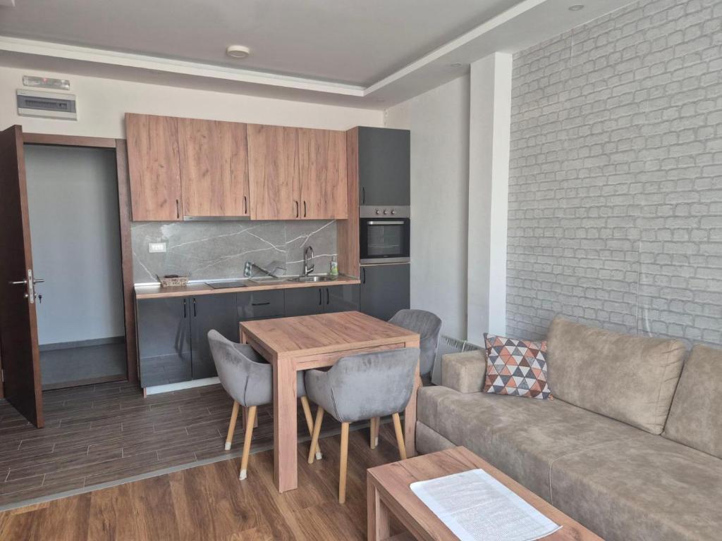 a living room with a couch and a table at President kop apartment 412 in Kopaonik