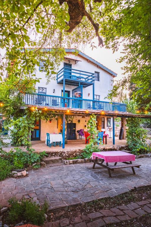 a house with a picnic table in front of it at Amara Nature Homes in Kaş