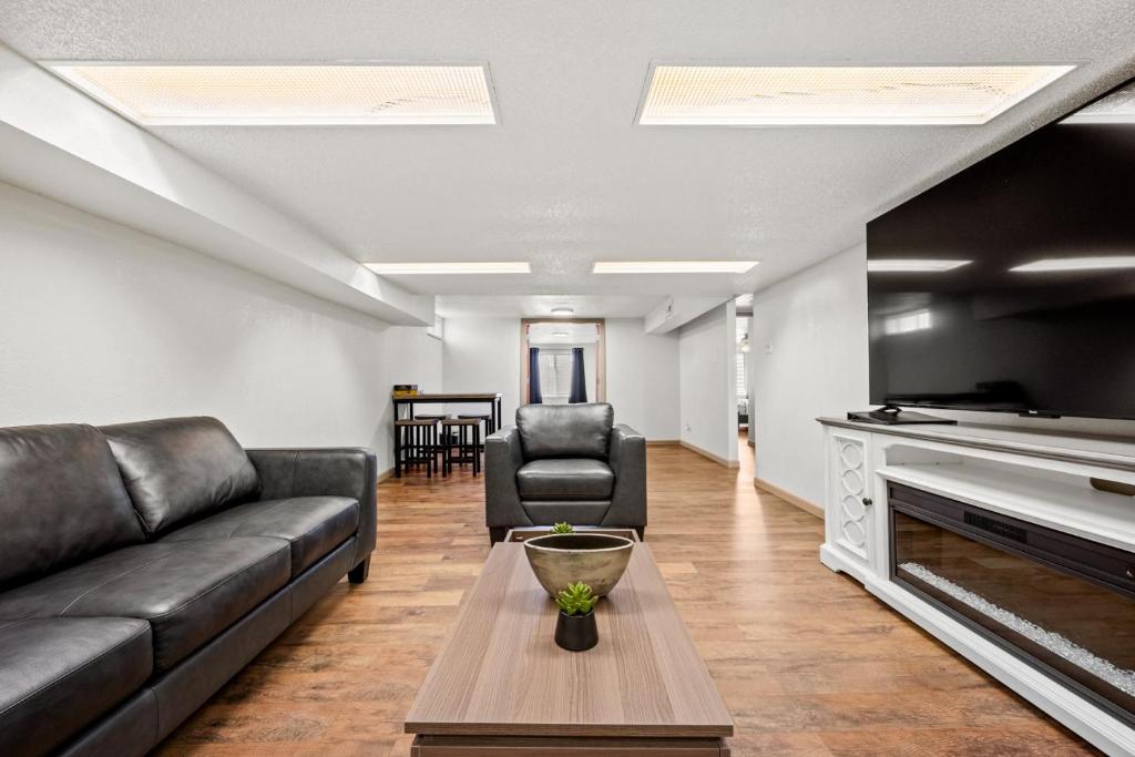 a living room with a couch and a table at Rancho Alegre Country Retreat in Pueblo