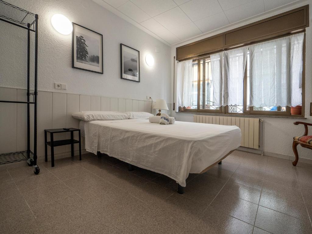 Postel nebo postele na pokoji v ubytování L'Hostalet GuestHouse