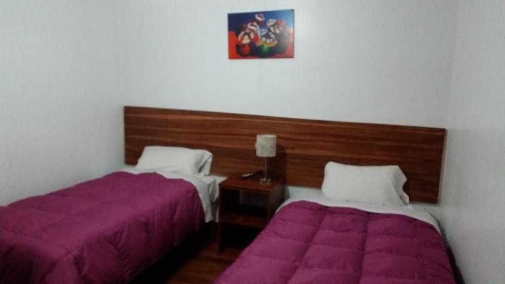 Postel nebo postele na pokoji v ubytování Inka's Rest Hostel