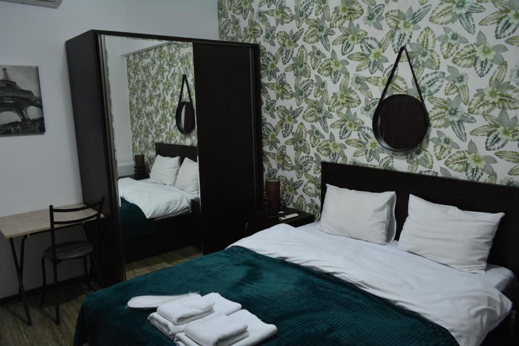 Postel nebo postele na pokoji v ubytování Nino's Hotel On Tsamebuli