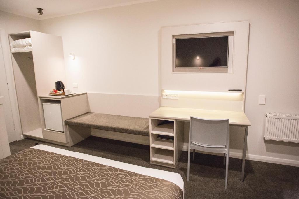 Postel nebo postele na pokoji v ubytování Wanaka Hotel