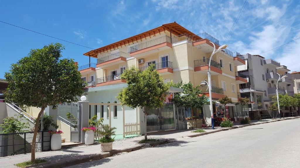 a building on the side of a street at Albi Apartments in Sarandë