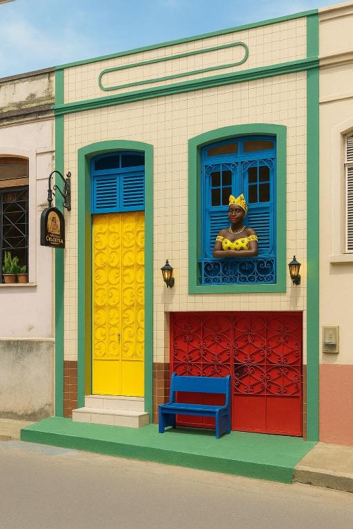 a mural of a building with a clown in a window at Hospedaria Colonial - Pousada e Hostel in São Luís
