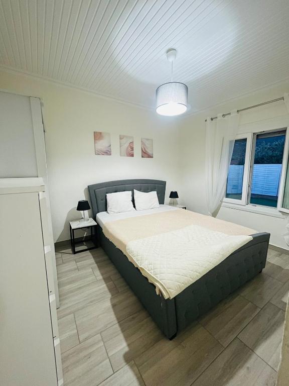 a bedroom with a large bed in a room at Seagull House Thassos island in Skala Kallirachis