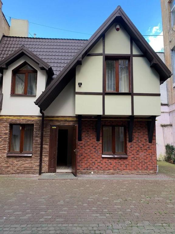 a brick house with a brown and white at Центрум Делюкс in Lviv