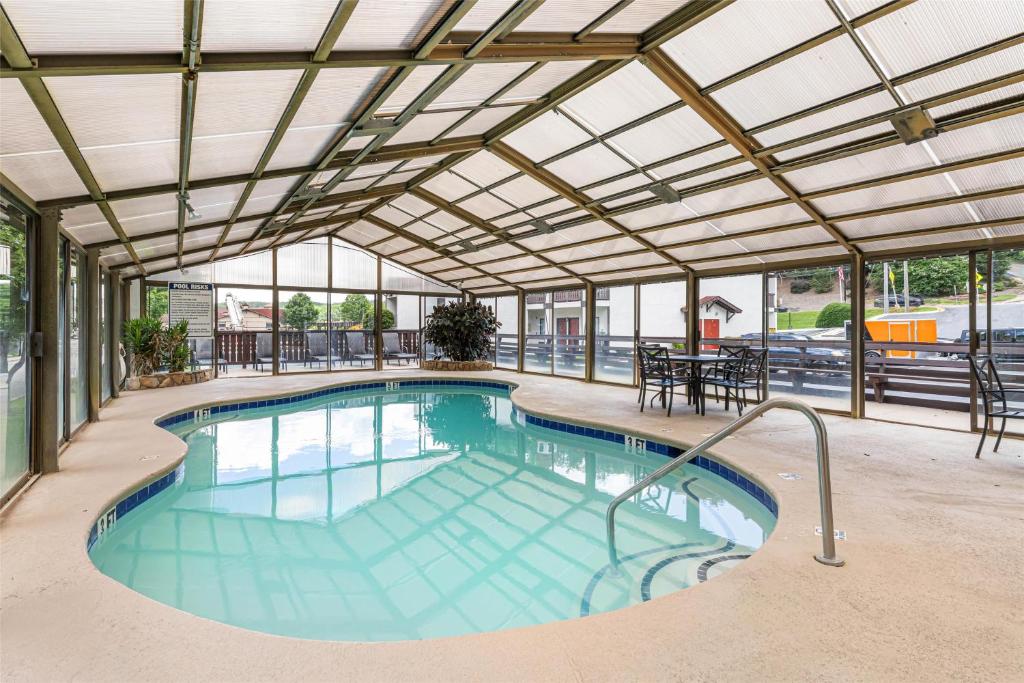 a swimming pool with an overhead building with a large swimming pool at SureStay Hotel by Best Western Helen Downtown in Helen