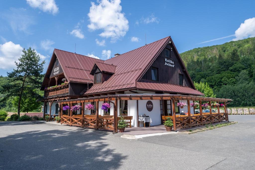 a large building with a red roof at Koliba Pod Horů in Dolní Bečva