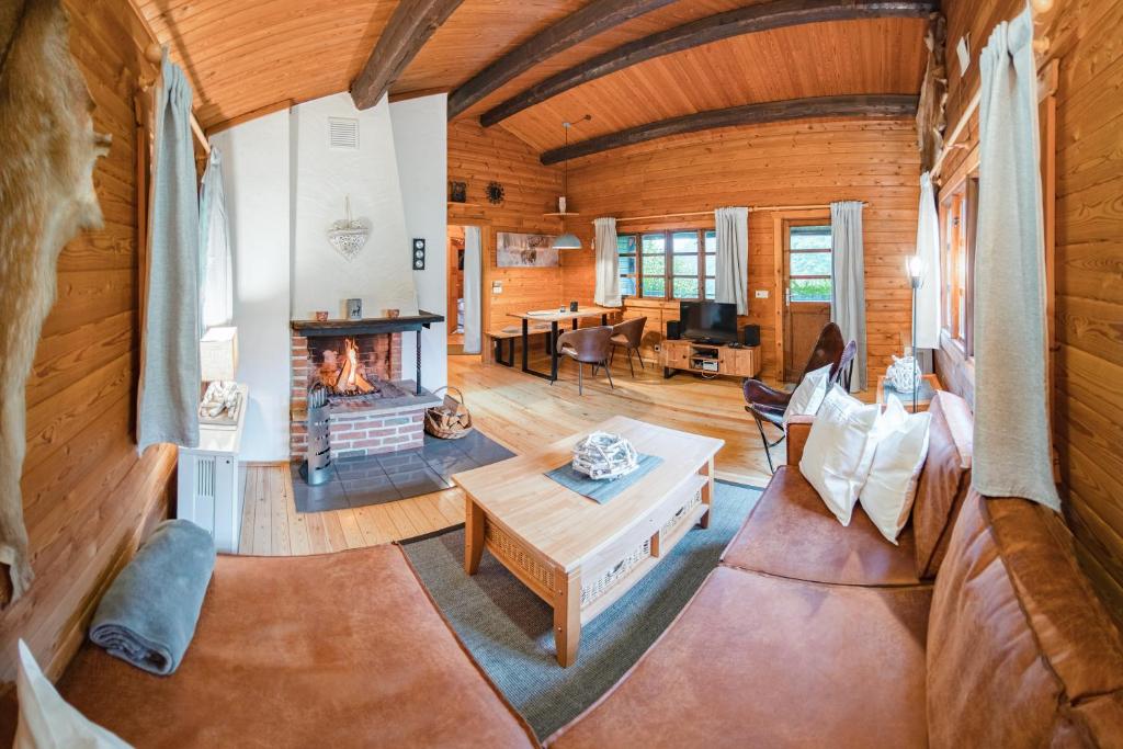 an overhead view of a living room with a fireplace at Bergcottage in Neerdar