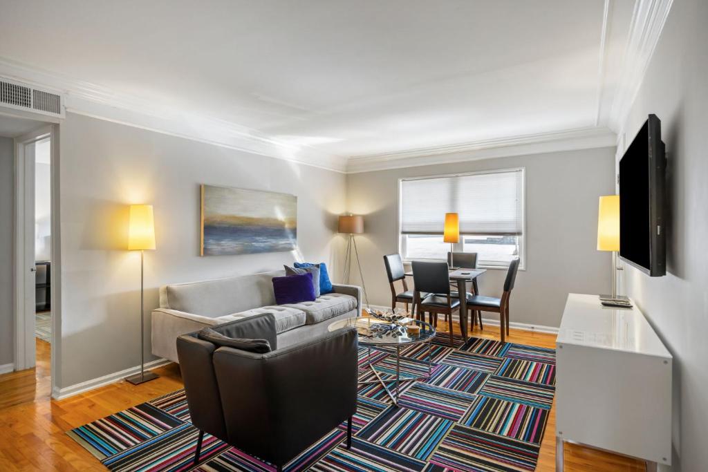 a living room with a couch and a table at Brookwood Courtyard by BCA Furnished Apartments in Atlanta