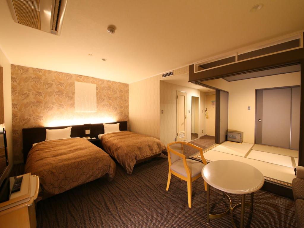 Postel nebo postele na pokoji v ubytování Resort Hotel Tateshina